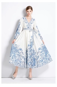 Close-up of blue floral porcelain print on white V-neck maxi dress with belted waist