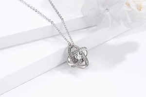 Close-up of S925 silver four-leaf clover pendant with sparkling cubic zirconia inlay