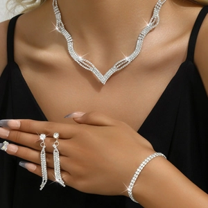 Elegant rhinestone jewelry set with necklace earrings and bracelet on fashion model