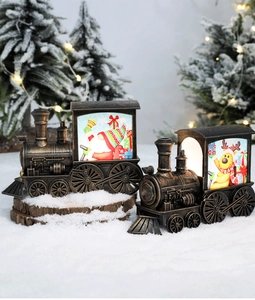 Detailed view of vintage-style Christmas train lanterns with Santa and reindeer scenes