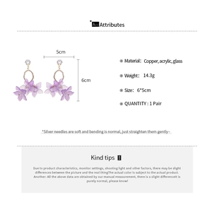 Detail view of purple flower earrings made of copper and acrylic with size and weight specs