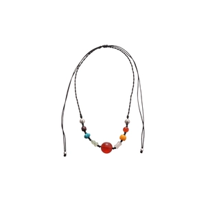 Ethnic beaded necklace with red stone and wood beads on adjustable black rope cord