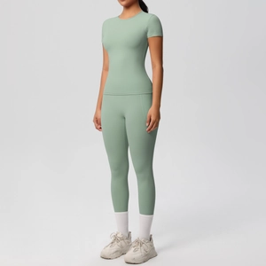 Detail of sage green yoga set with slim fit short sleeve top and high waist leggings