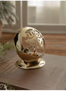 Golden Christmas hollow metal candle holder with star patterns on vintage books