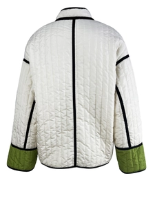 Detailed back view of quilted jacket featuring contrast trim and olive green sleeve panels