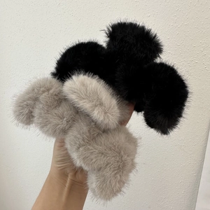 Furry plush hair claw clips in black and beige for women's elegant winter hairstyles