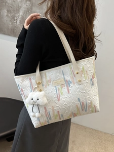 White canvas tote bag with colorful embroidery and plush cloud charm for women