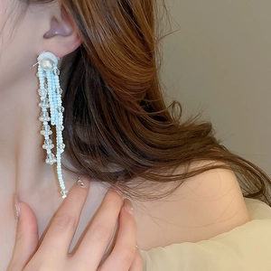 Elegant blue and white bead tassel earrings with faux pearl detail for a refined look