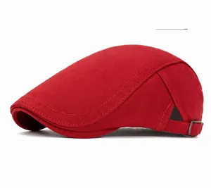 Detail view of cotton baker boy hat with reinforced double stitching and metal buckle