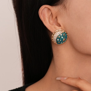 Vintage gold star and moon planet earrings with dark blue enamel and rhinestones