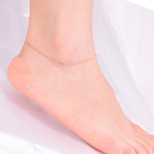 Elegant 18K rose gold snake chain anklet with minimalist vertical bar on woman ankle