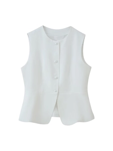 Detail of white sleeveless vest with pearl buttons and ruffled hem in soft woven fabric