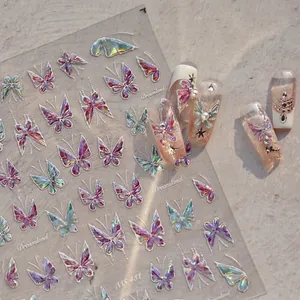 Iridescent 3D butterfly nail art decals with holographic metallic effect on stone surface