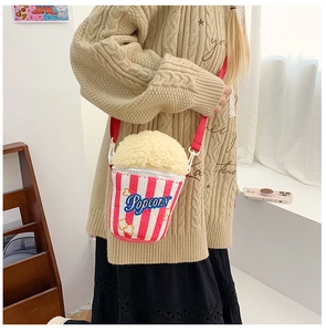 Creative popcorn bucket crossbody bag with red stripes and soft plush popcorn texture