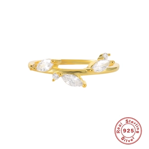 Detail of 925 sterling silver golden ring with marquise cut leaf shaped crystals