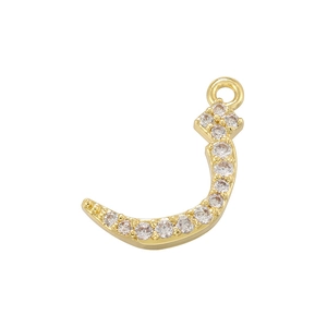 Detailed view of a gold-plated Arabic letter pendant with sparkling zircon inlays
