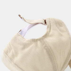 Detail of adjustable velcro strap on toddler beige corduroy baseball cap back
