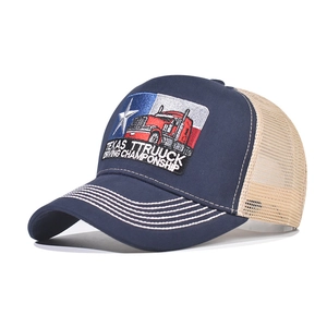 Side view detail of navy cotton trucker hat with intricate Texas truck embroidery
