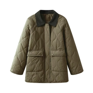 Detail of olive green quilted jacket featuring corduroy collar and large symmetrical pockets