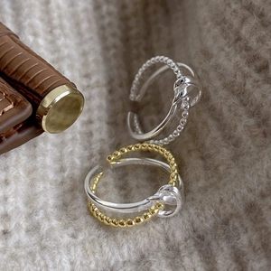 Minimalist S925 sterling silver knotted ring set in silver and gold-tone finish