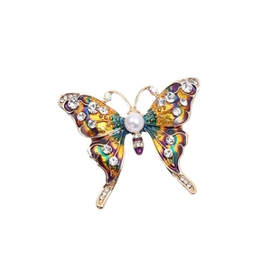 Elegant gold butterfly brooch with colorful enamel wings, sparkling rhinestones and pearl