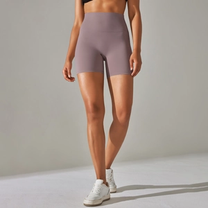Macro detail of high-waisted purple yoga shorts showing seamless brushed fabric texture