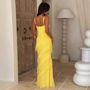 Back view of a slim yellow backless dress with tiered ruffles and side slit for women