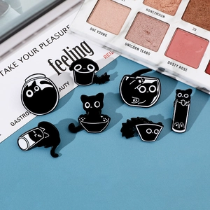 Detailed set of seven funny black cat enamel pins showing cats in jars and fishbowls
