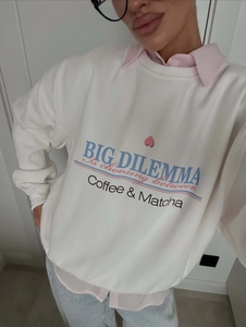 Oversize white sweatshirt with coffee and matcha print layered over a pink shirt