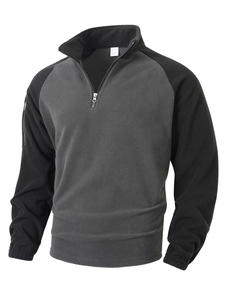 Detail of grey fleece sweatshirt with half-zip collar and soft thermal fabric texture