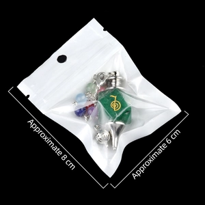 Green chakra stone pendulum with Reiki Cho Ku Rei symbol and colorful bead chain