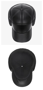Detail view of black faux leather winter cap with earflaps and thick warm plush lining