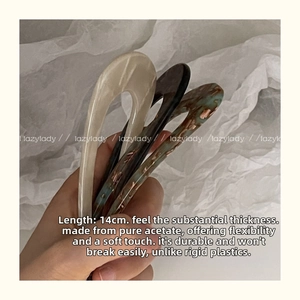 Detail view of 14cm acetic acid U-shaped hair pins showing durability and texture