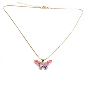 Detail shot of a gold butterfly pendant with blue and pink enamel on a slim chain