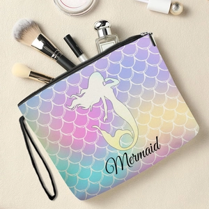 Mermaid scale makeup bag with colorful gradient print and black wristlet zipper
