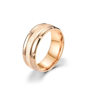 Detail of rose gold titanium ring featuring brushed texture and geometric facets