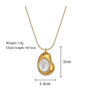 Minimalist gold snake chain necklace with white cat eye pendant and size measurements