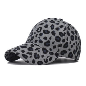 Detailed view of the leopard print corduroy texture on a gray baseball cap crown