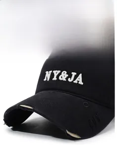 Close-up of black cotton baseball cap with NY&JA 3D embroidery and distressed brim edge