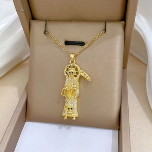 Detailed macro view of Santa Muerte gold plated pendant with pavé set white zirconias
