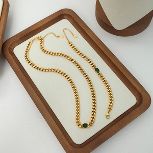 British vintage gold plated titanium steel Cuban chain set with green zircons