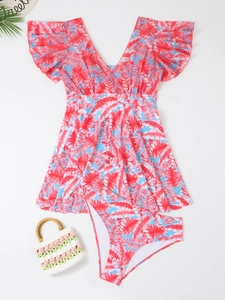 Detailed flat lay of a floral two-piece tankini swimsuit with tropical palm leaf prints