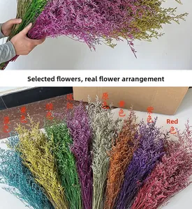 Close-up detail of various dyed preserved Statice flowers in a colorful bundle