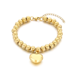 18K gold-plated beaded bracelet with a hollow heart pendant on a white background