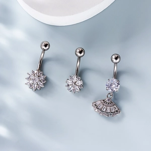 Three silver stainless steel belly rings with zircon flowers and fan pendant in set