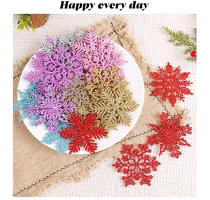 Glittering plastic snowflake ornaments in various colors displayed on a white plate