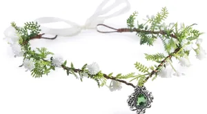 Detail of floral crown with green crystal pendant and vintage white flowers on vine