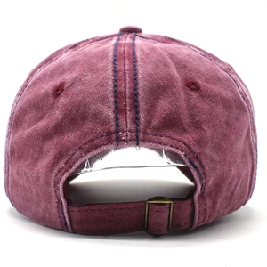 Detail of vintage washed cotton baseball cap with adjustable metal buckle back