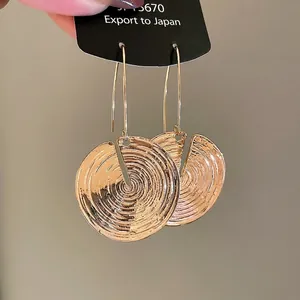 Golden round spiral textured drop earrings with concentric circles for women