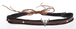Macro detail of western bull skull pendant on black woven rope and brown leather necklace